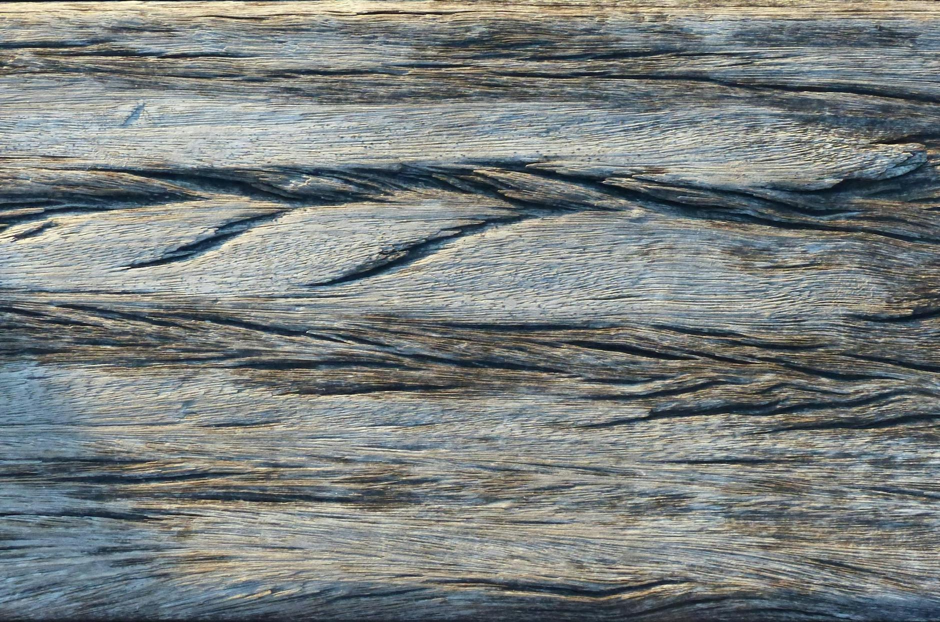 Before and after cabinet refinishing transformation showing restored wood finish